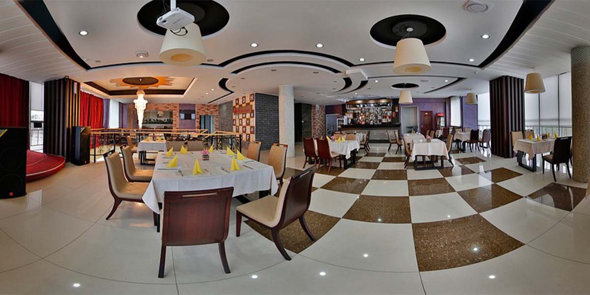 luxury dining space for hospitality interior featured with checked flooring and stylish ceiling design work