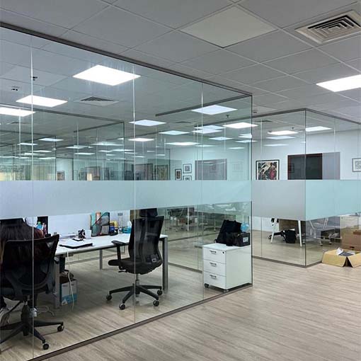 two-offices-divided-by-glass-partitions